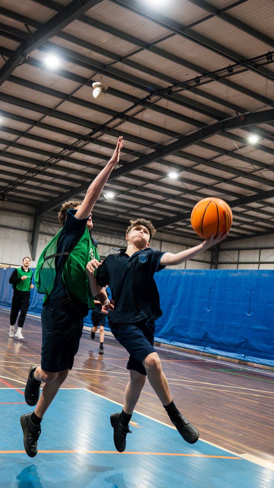 Students contesting a layup
