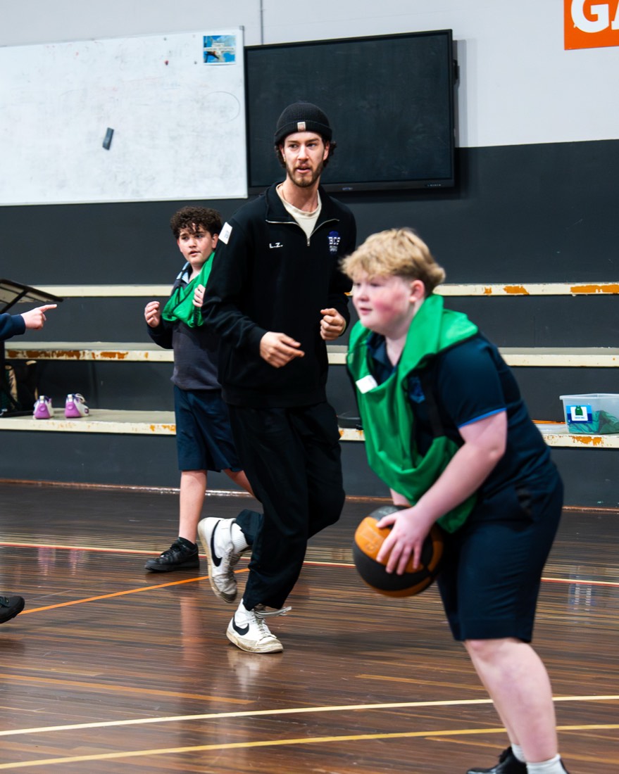Coach defending a student in a one-on-one drill