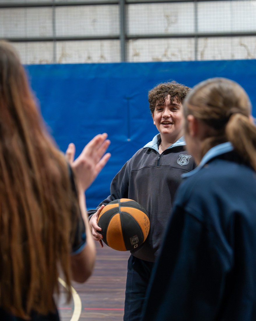 Students talking together on court
