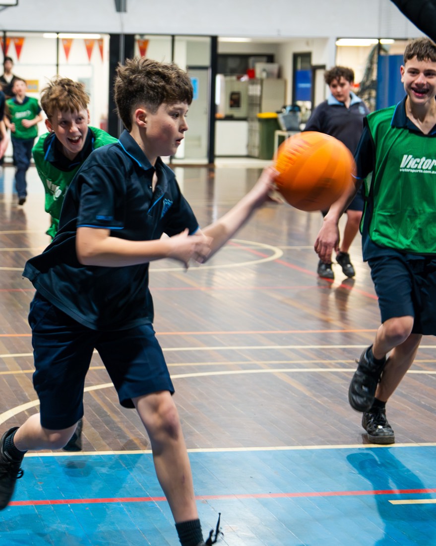Students competing for the ball in a game