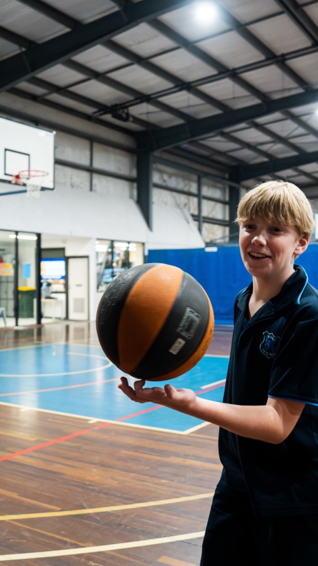 Student spinning a basketball