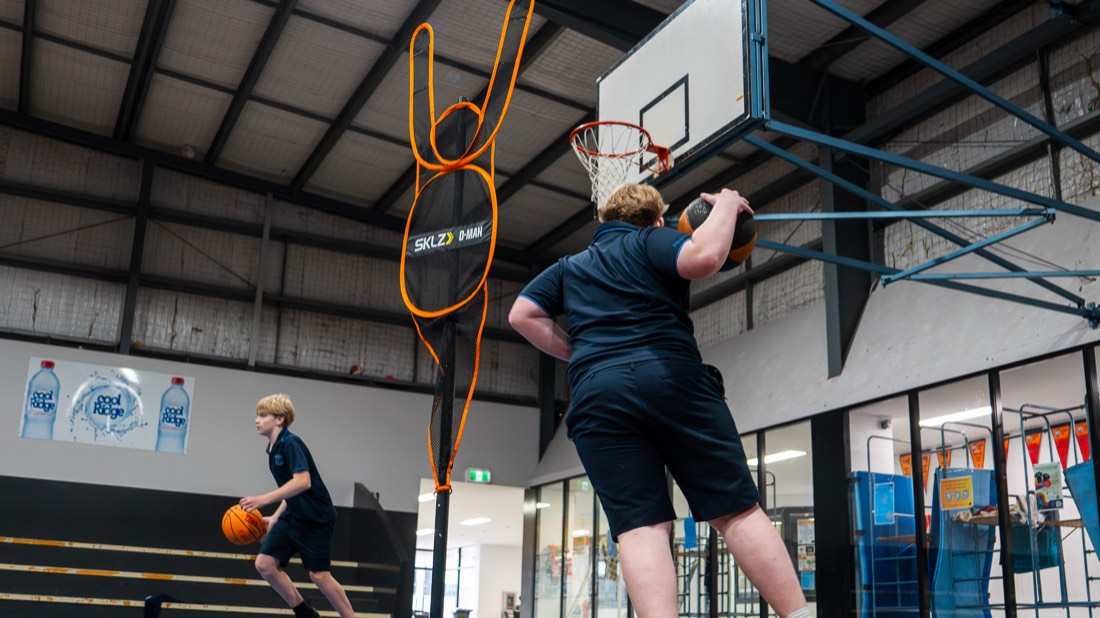 Student shooting at the hoop